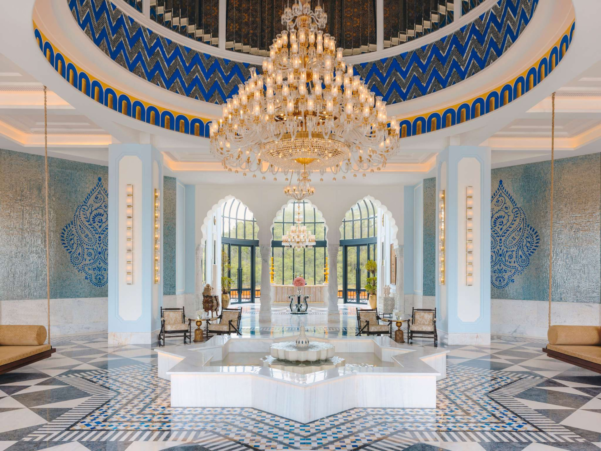 Fairmont Udaipur Palace lobby with crystal chandelier and marble fountain